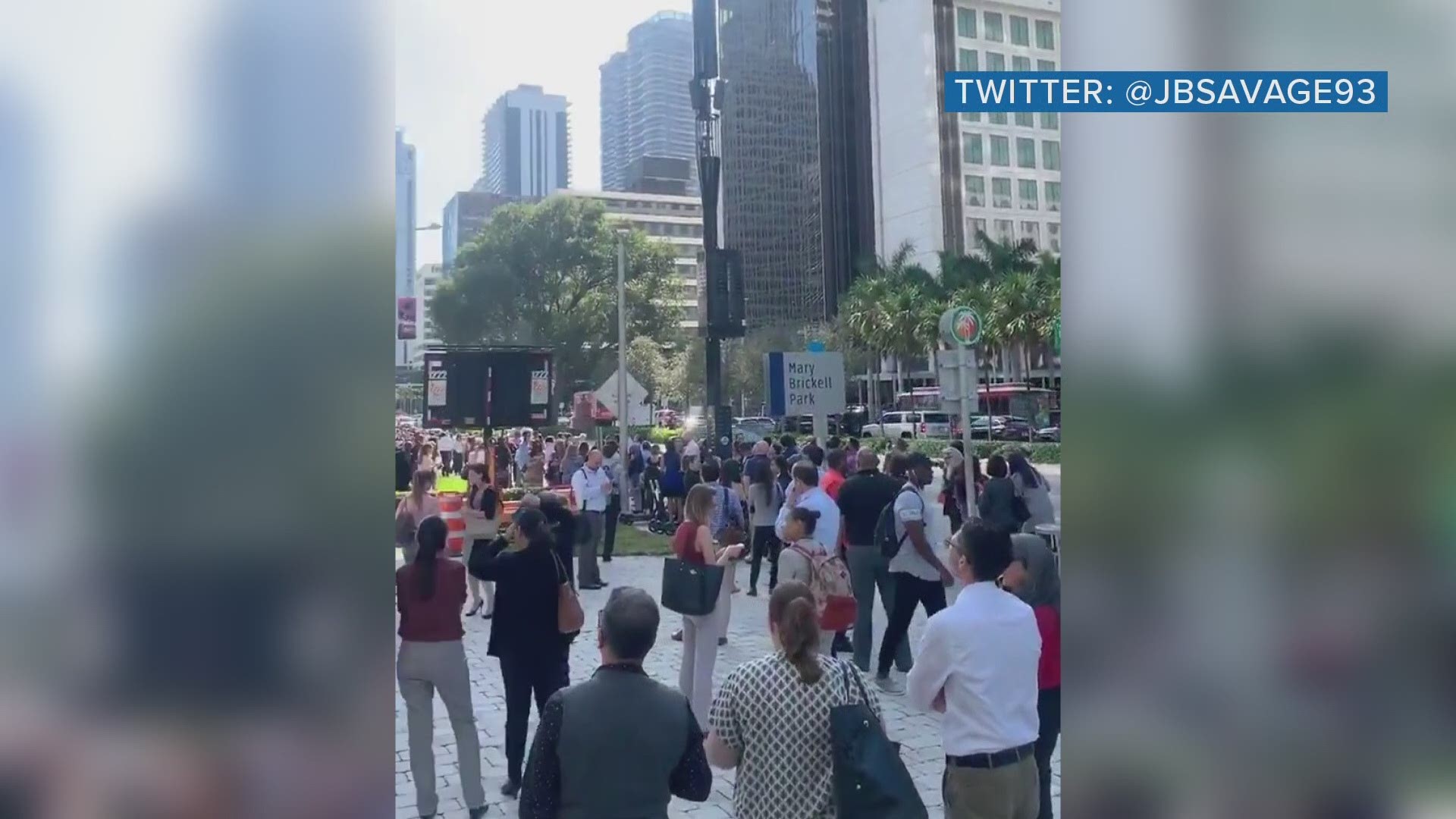 People in Miami gather outside after reports of buildings shaking following the 7.7 magnitude earthquake in the Caribbean Sea.