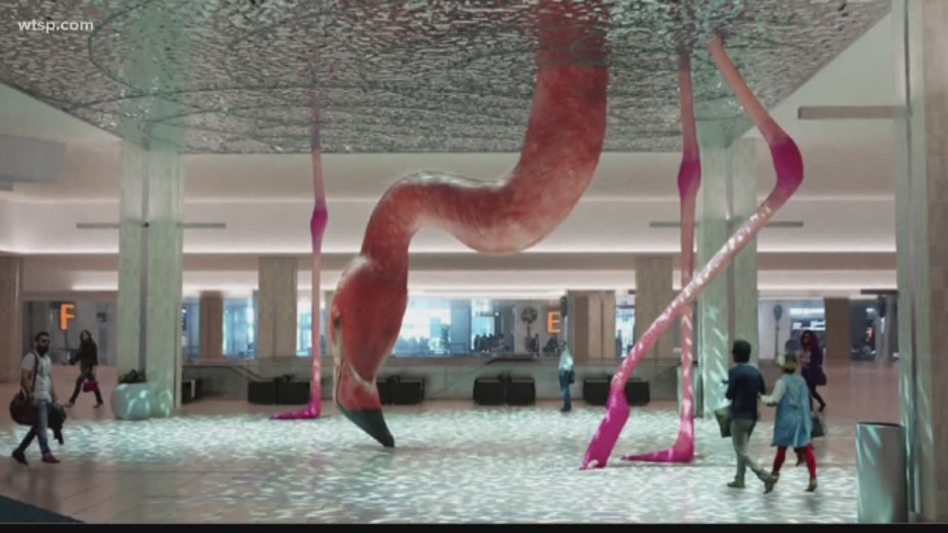It’s called HOME by Matthew Mazzotta. It’s a floor-to-ceiling sculpture of a flamingo dipping its head into the water.