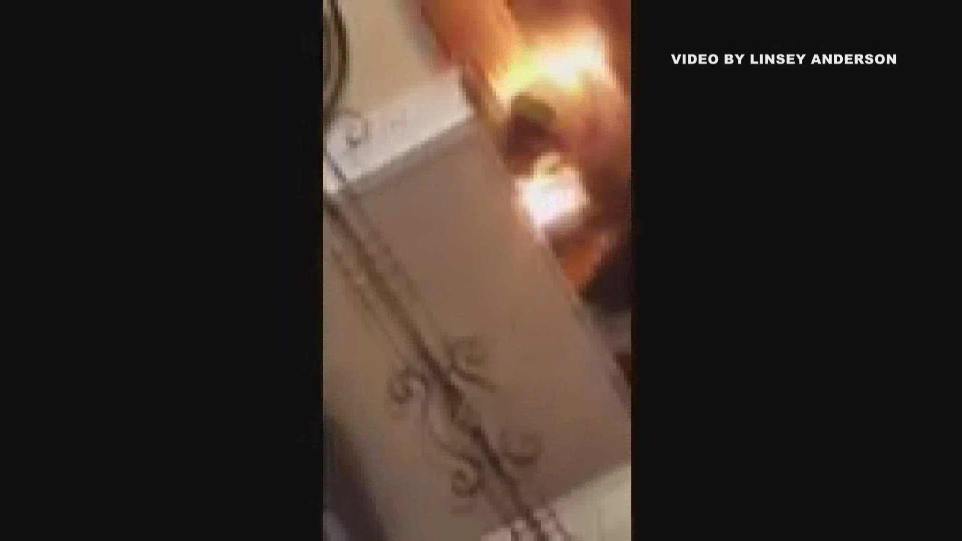 Home video shows a house fire starting when a battery blows up.