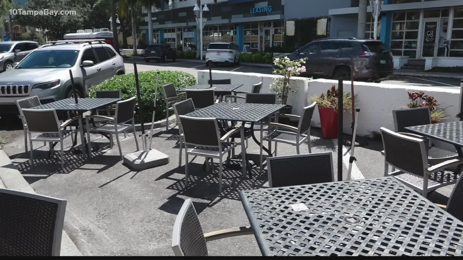 The parklets, tables set-up behind concrete barriers, were a temporary solution created earlier in the pandemic.