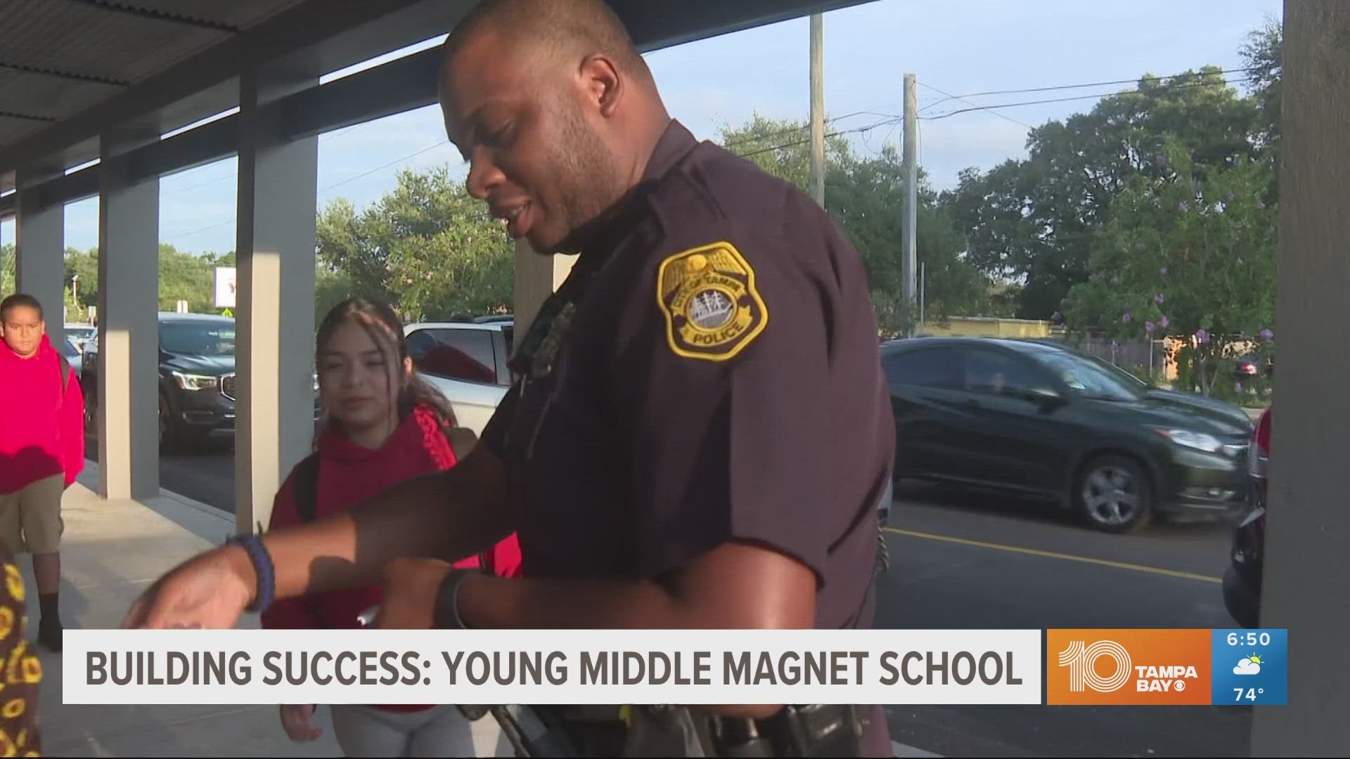 Officer Rodney Riviere connects with students and staff as this magnet school helps students along the path to success.