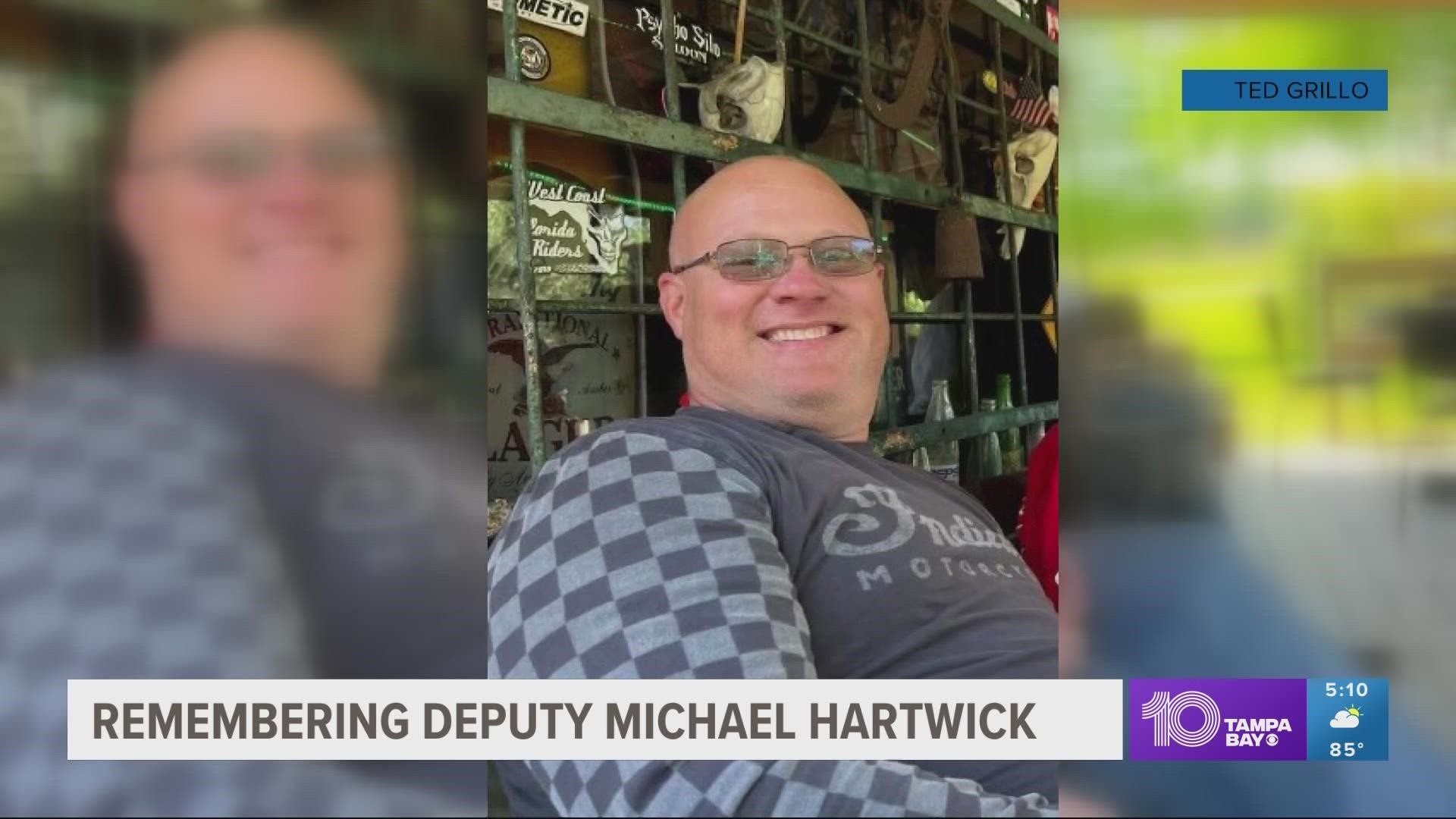 The sheriff's office says the man accused of hitting Deputy Michael Hartwick with a large front loader drove for another quarter of a mile before fleeing the area.