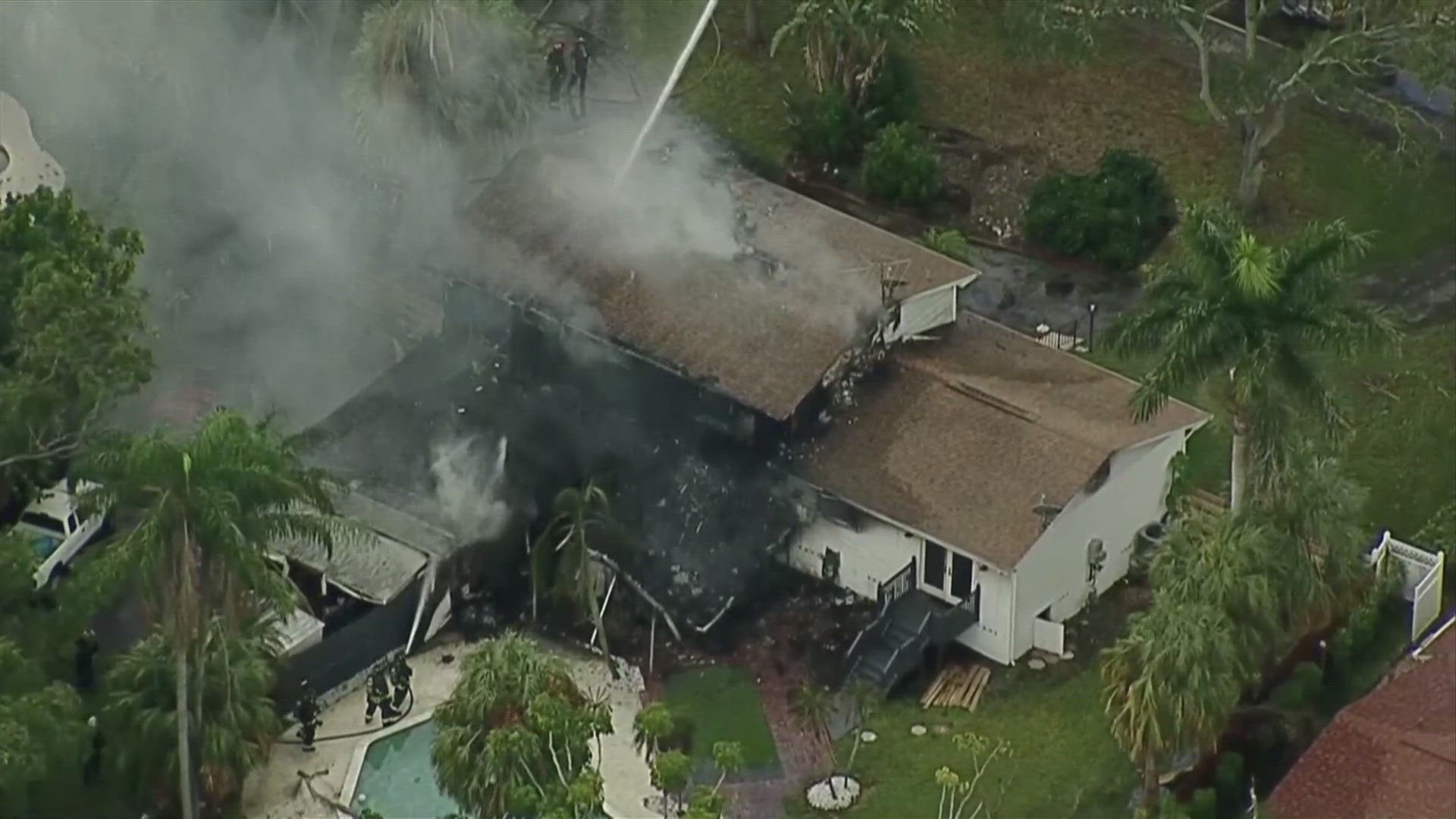 Firefighters are working to put out a house fire in the St. Petersburg's Shore Acres neighborhood.