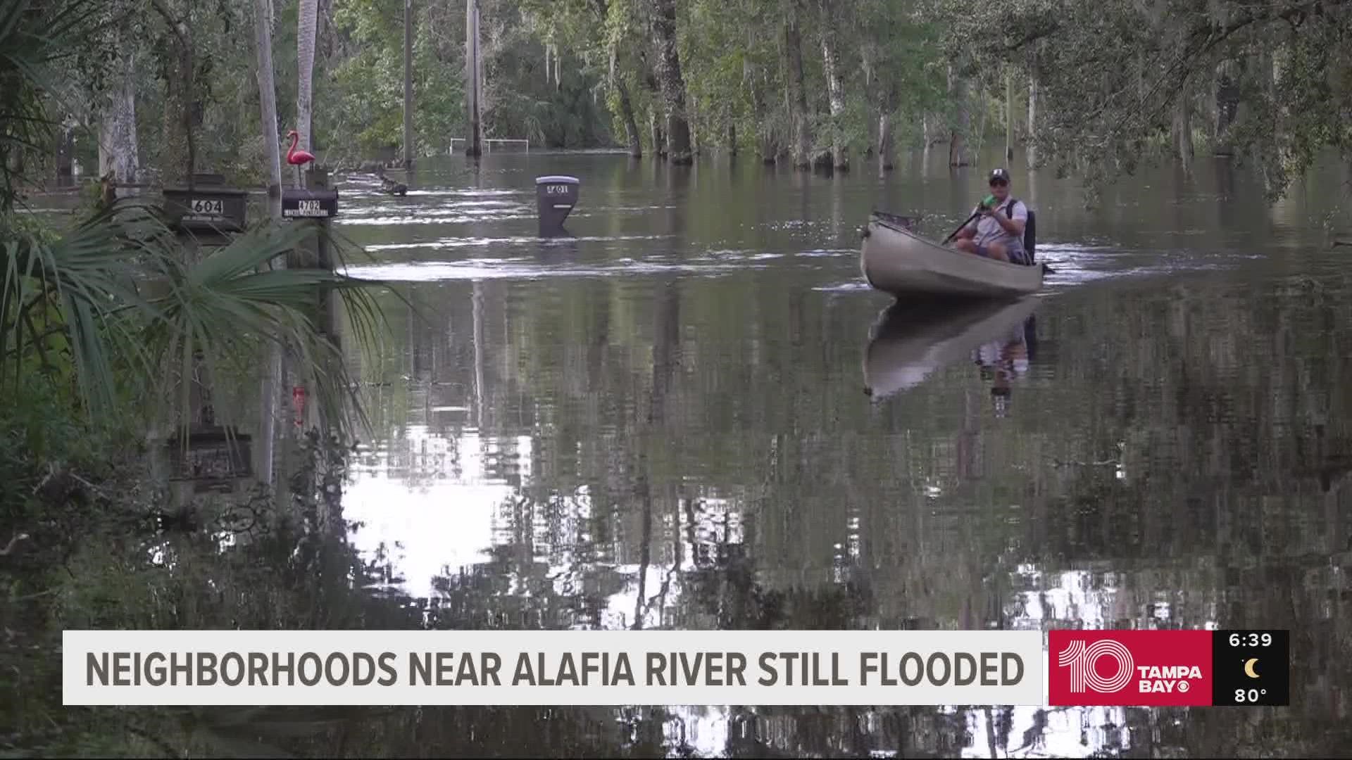 Some residents living along the Alafia River have resorted to getting around via canoes, but they say their spirits are high.