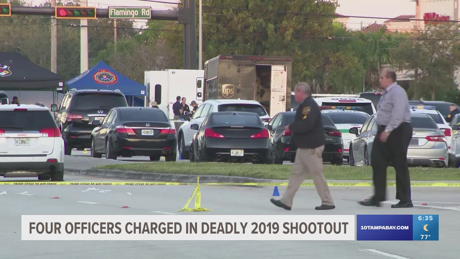 The shootout happened when two robbers led police on a chase and hijacked a UPS van. One officer is facing two counts of manslaughter and the others are facing one.