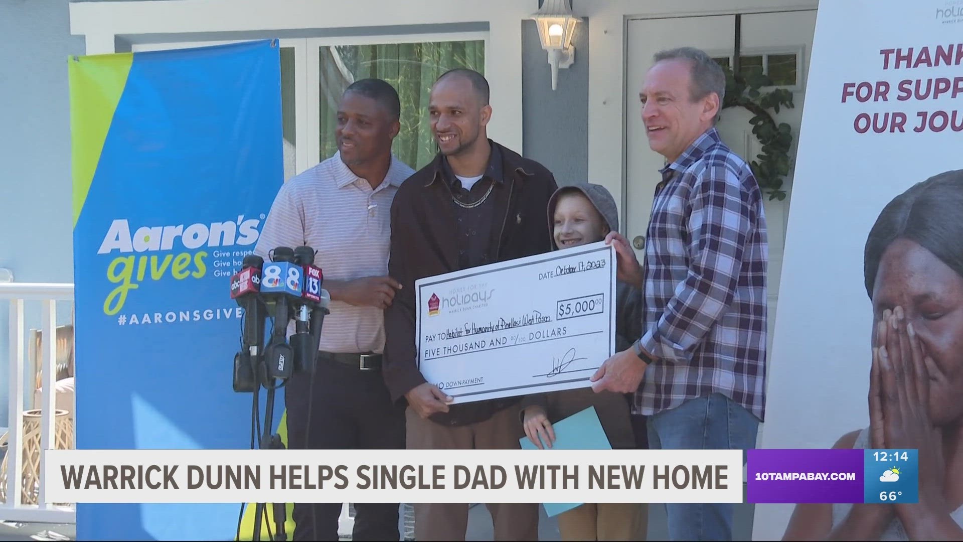 Dunn's charity partnered with Habitat for Humanity to help a single dad and his 10-year-old son have a new home.