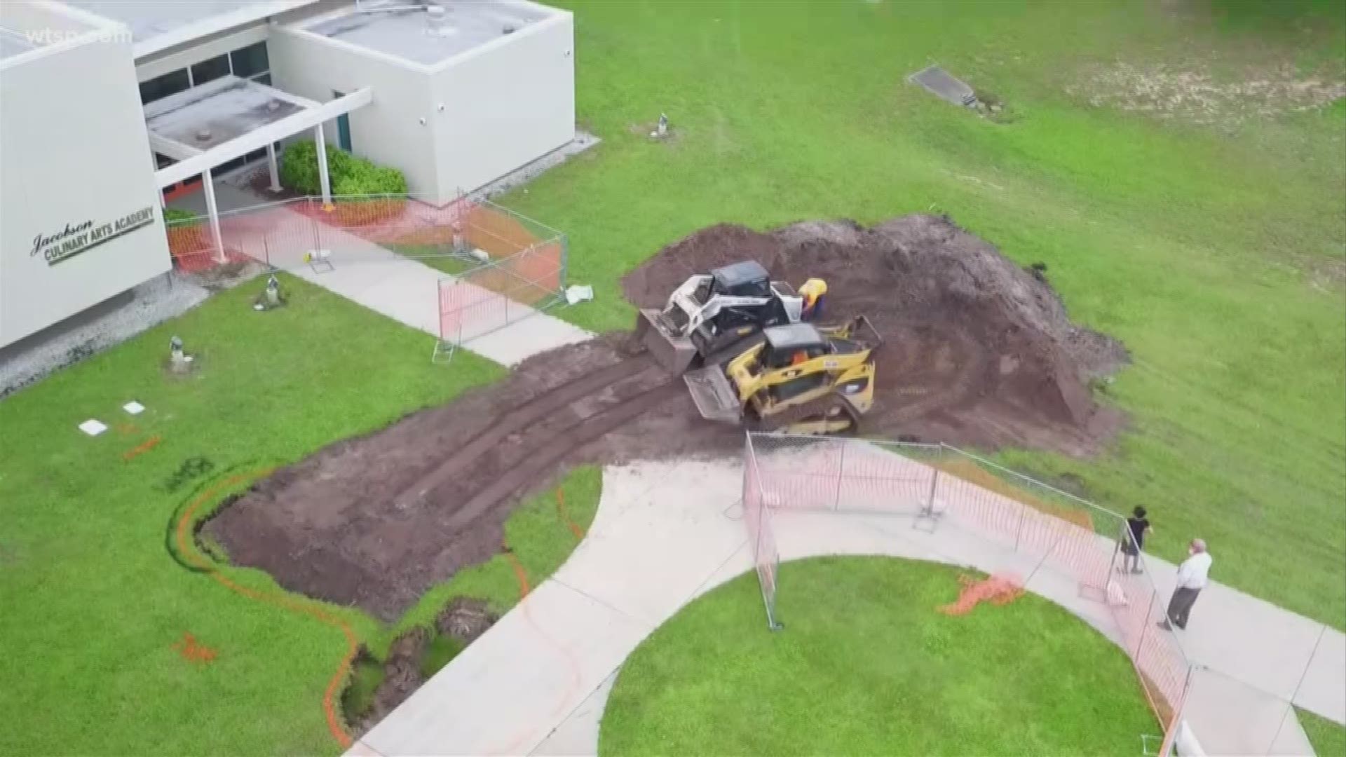 A large hole opened up Friday morning on the Tarpon Springs High School campus.

The hole is near the school's culinary building. The hole appears to be close to a sidewalk, and photos show chunks of grass had fallen in the opening filled with dirt.

Pinellas County school district spokesperson Lisa Wolf-Chason said a staff member noticed the hole around 6:45 a.m. Friday before students arrived. The district facility staff is responding and will evaluate what the hole is and how to proceed.
