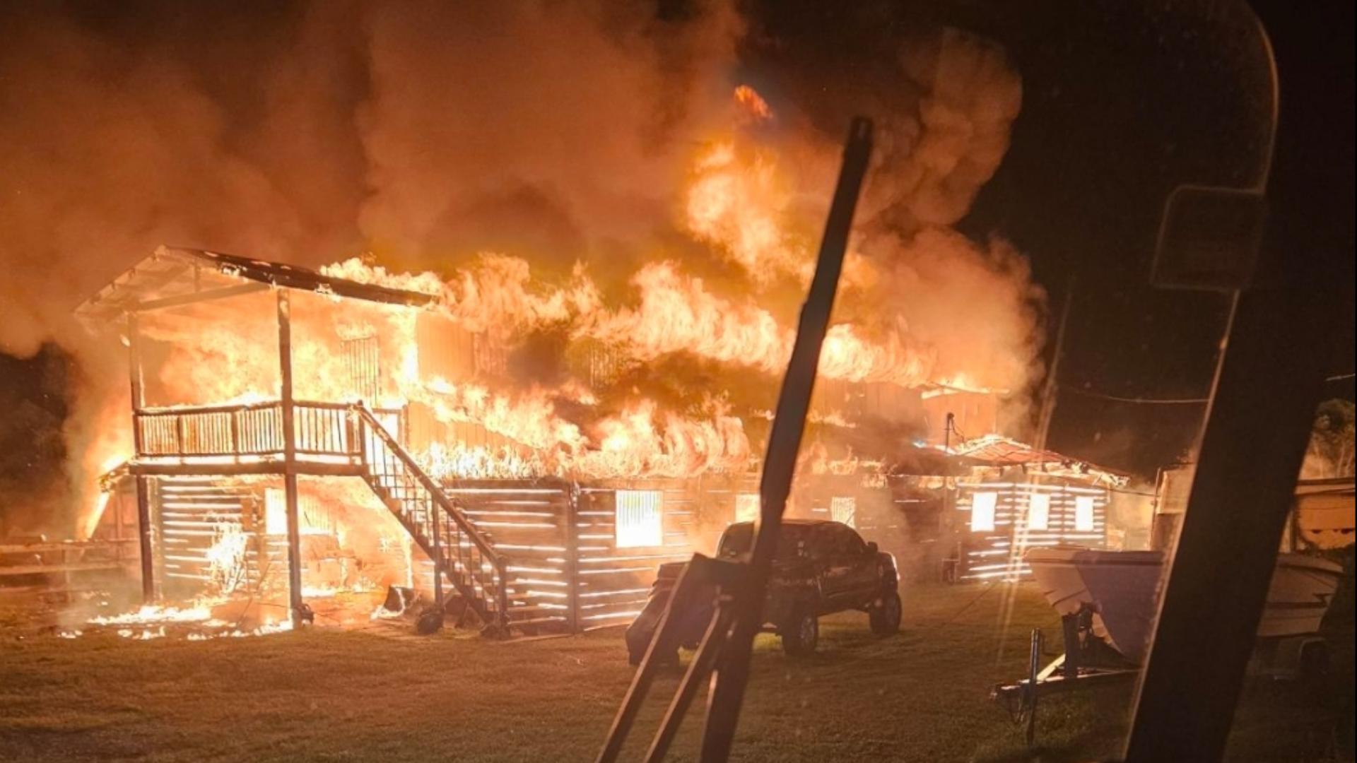 Photos show the second-floor apartment and horse stables underneath were destroyed by the fire that engulfed the whole building.