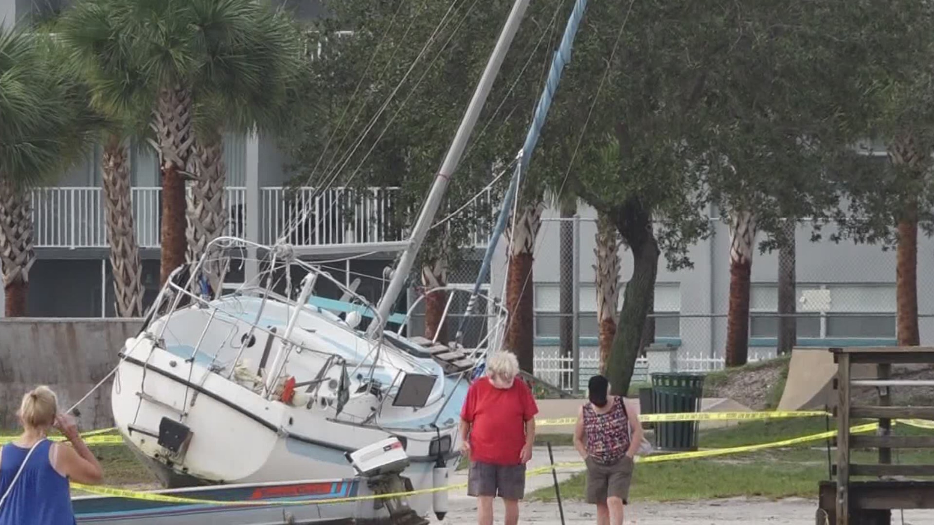Heavy machinery operators spent the day Monday trying to remove some sailboats blown ashore by the storm.