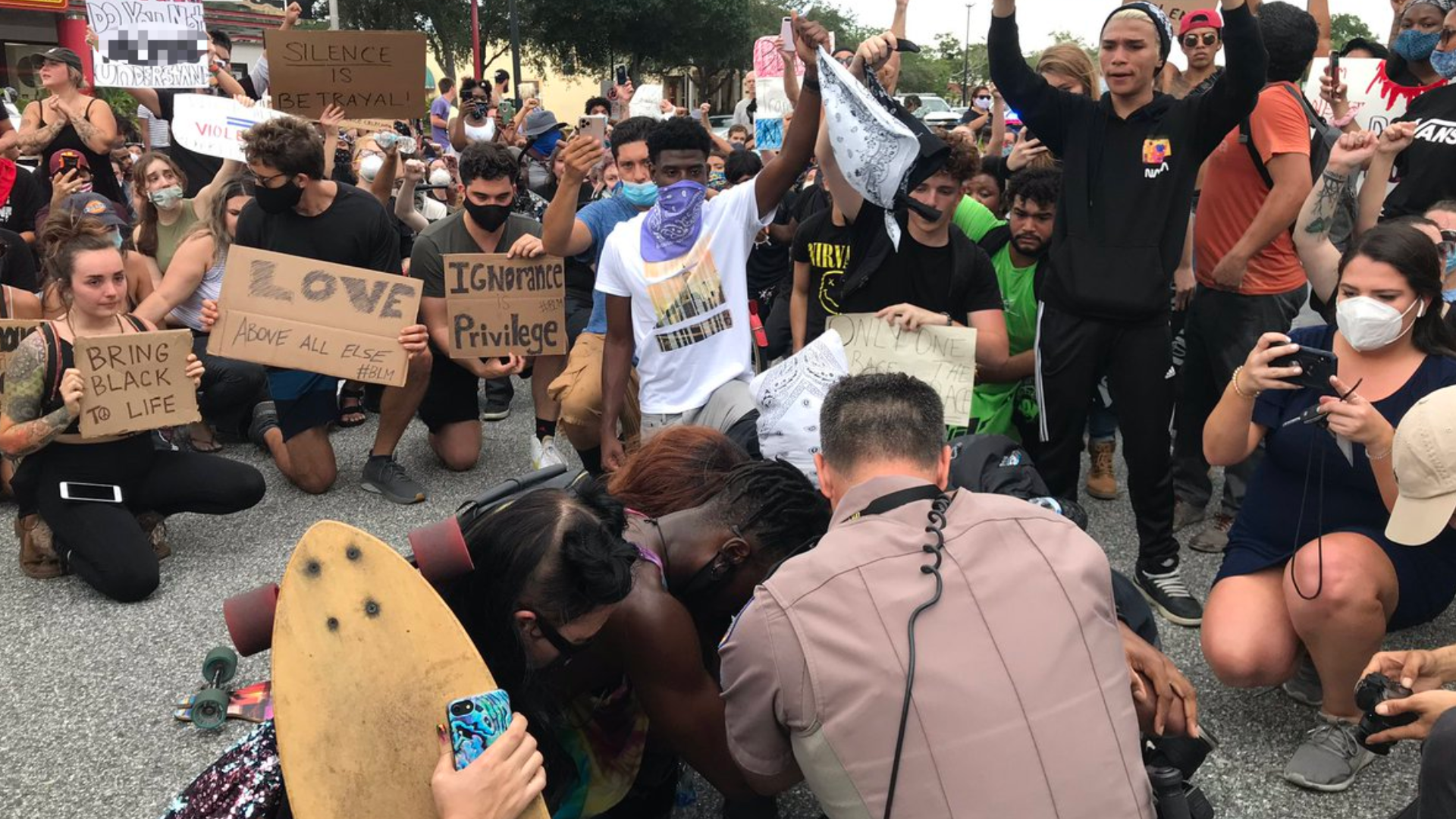 State and local law enforcement kneeled down in solidarity following the death of George Floyd in Minneapolis.