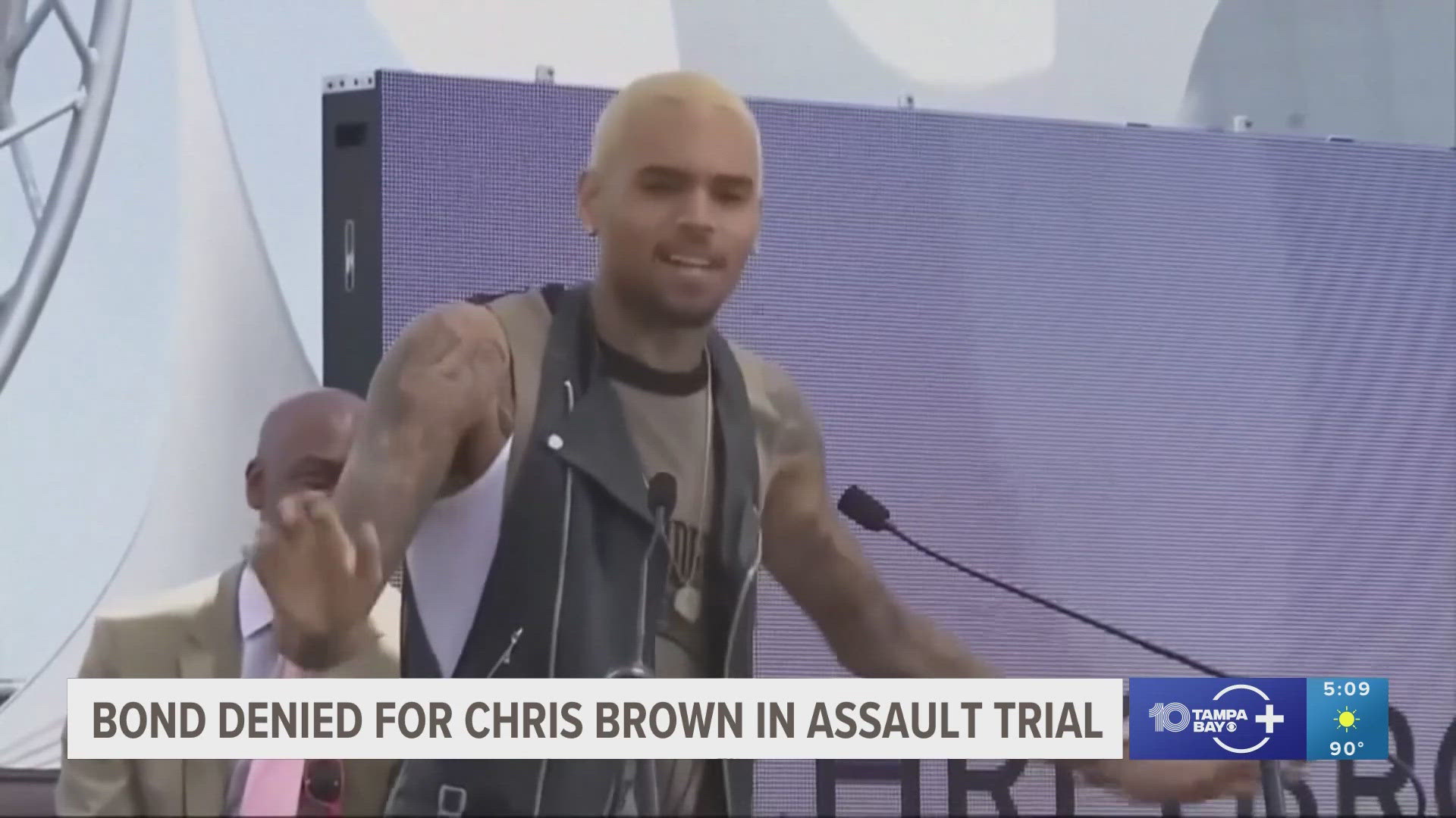 A producer with a British tabloid said Brown cracked him on the head with a bottle and punched and kicked him on the floor.