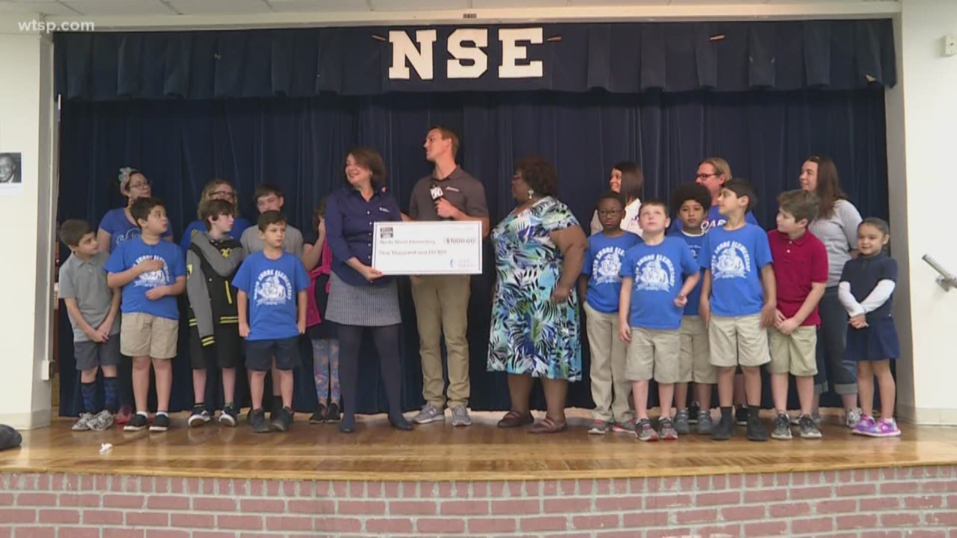 Duke Energy Florida presents $1,000 check to North Shore Elementary School.