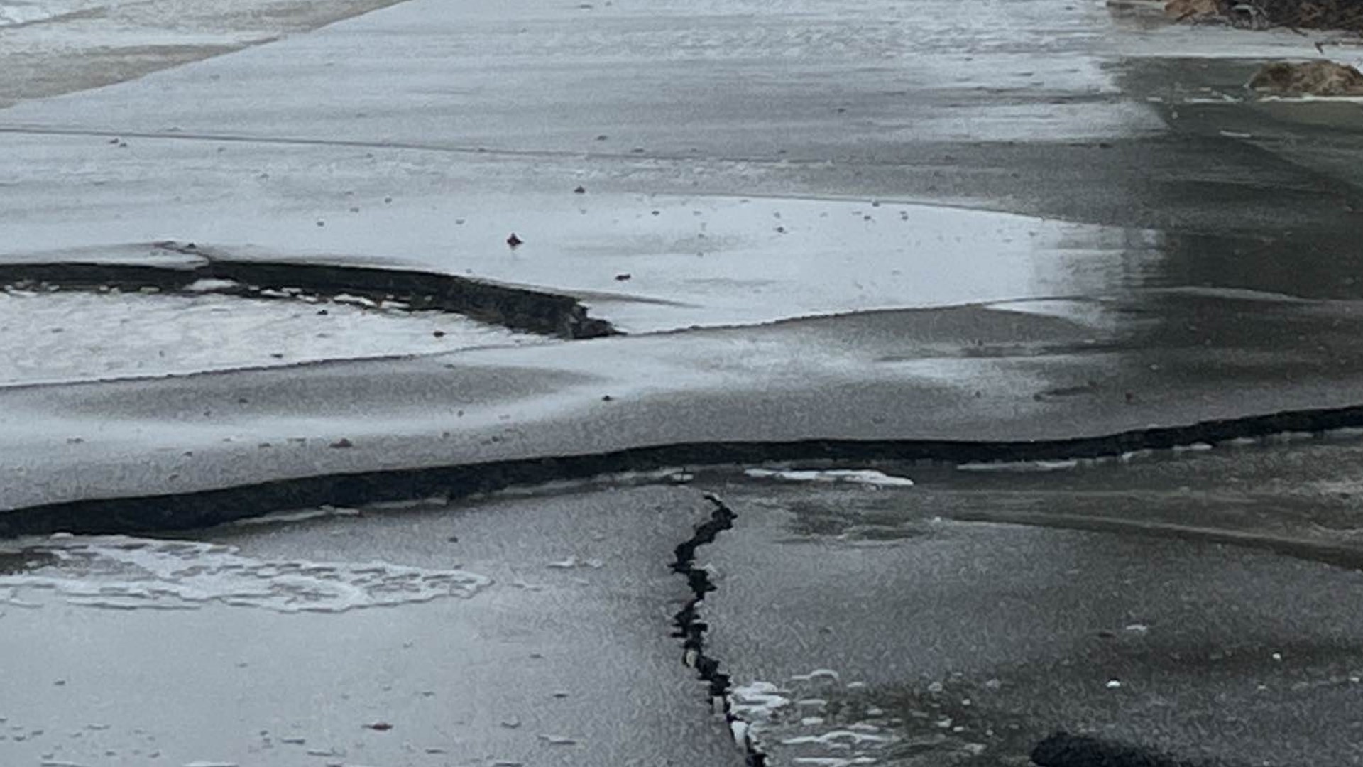 Casey Key Road is buckled and cracked due to waves from the Gulf of Mexico continuously crashing into it.