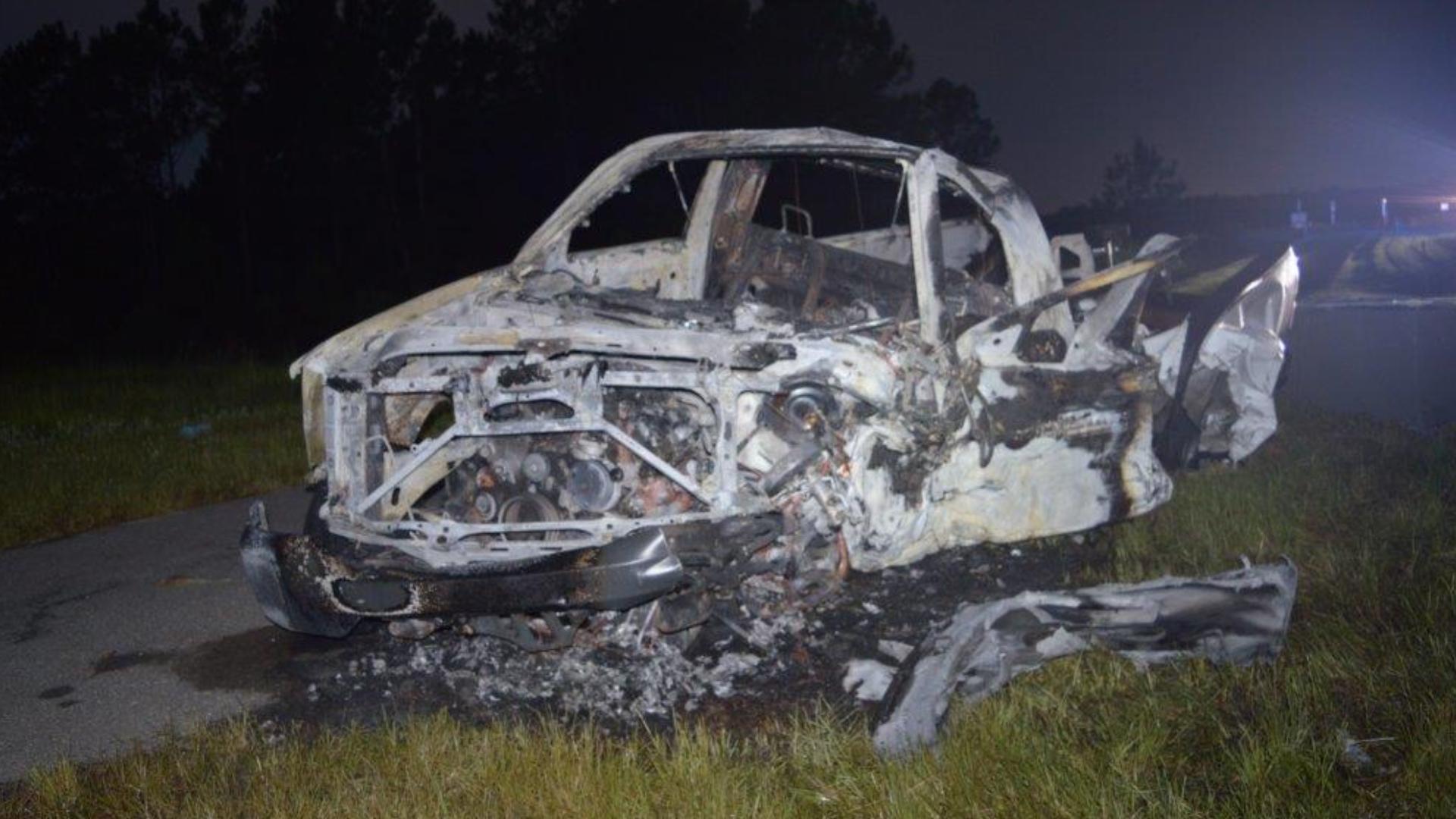 Two cars collided head-on with one of them flipping and bursting into flames, troopers said.