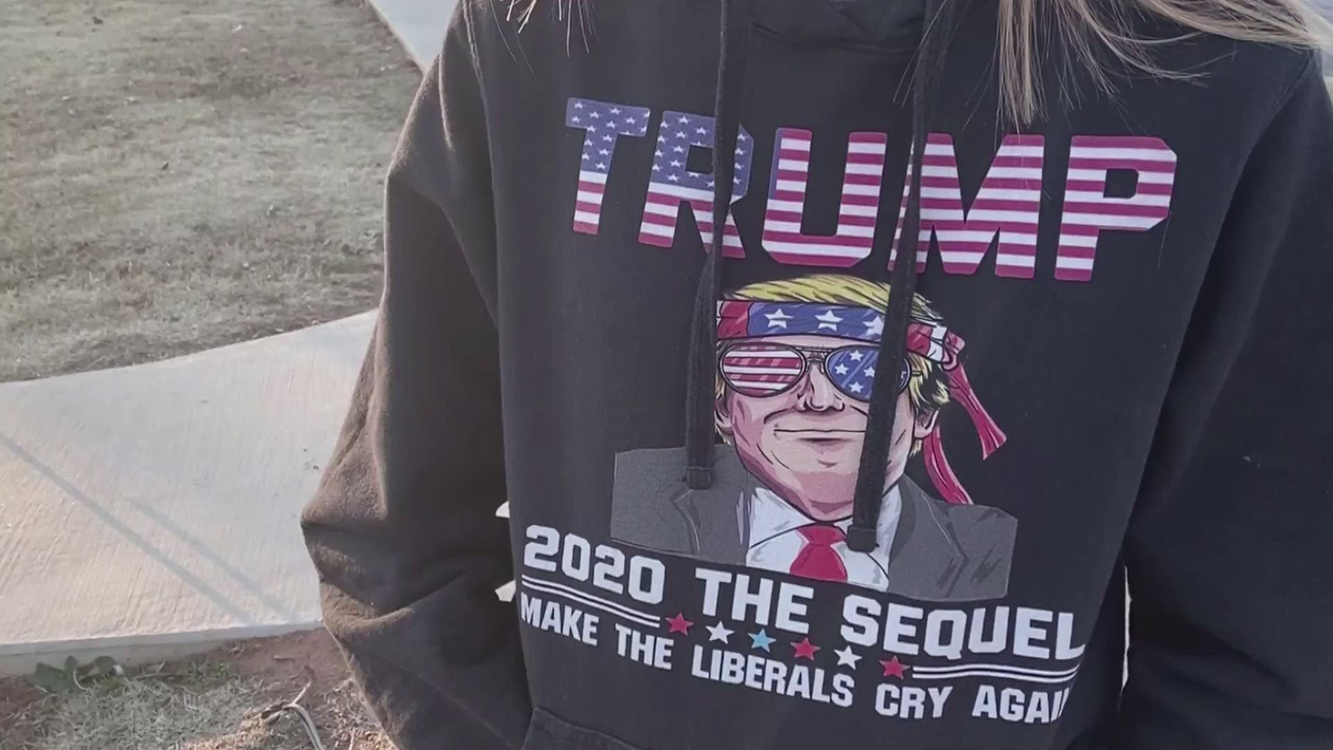 A mother claims her daughter's classmates threatened to shoot the girl because she wore a sweatshirt depicting President Donald Trump.