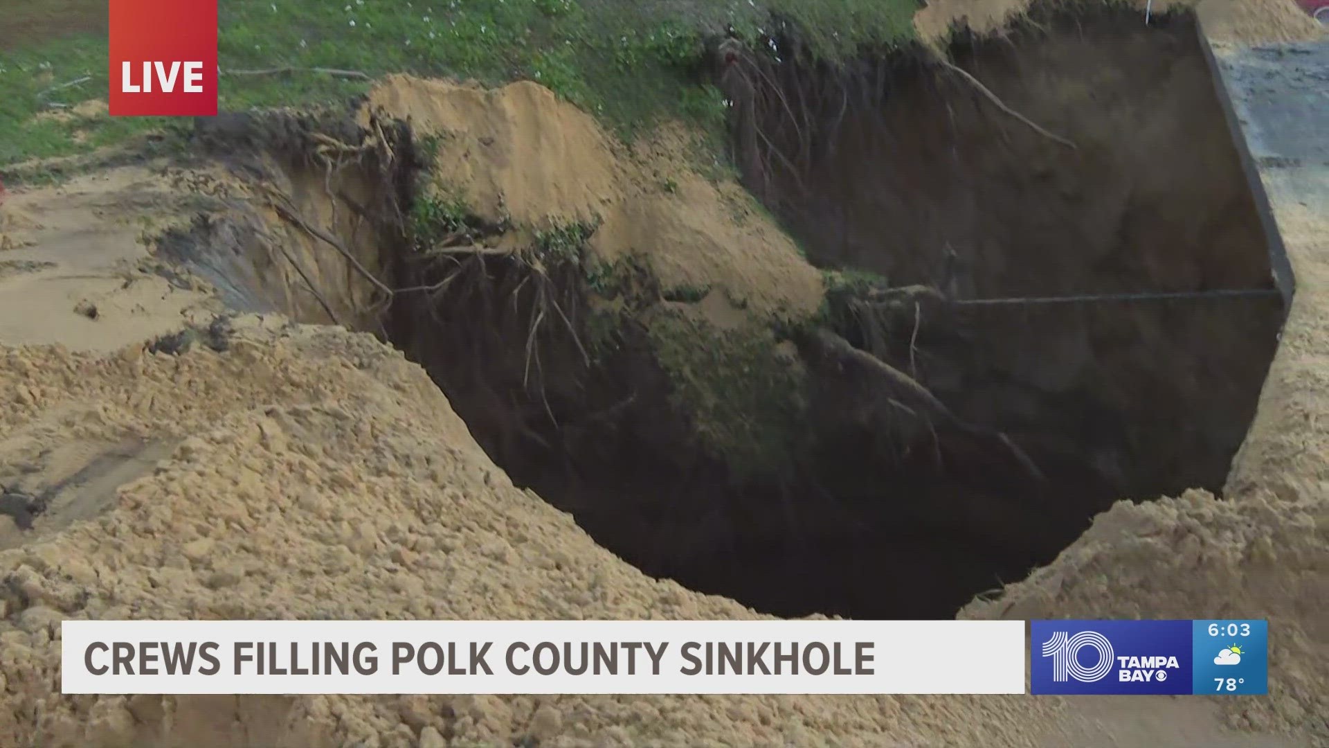 The county says the sinkhole grew to an estimated 30 feet wide and at least 60 feet deep.