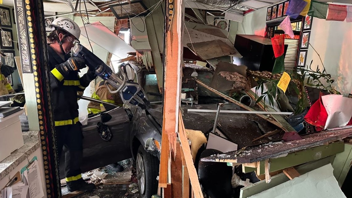 1 in the hospital after car crashes into Tampa tattoo shop