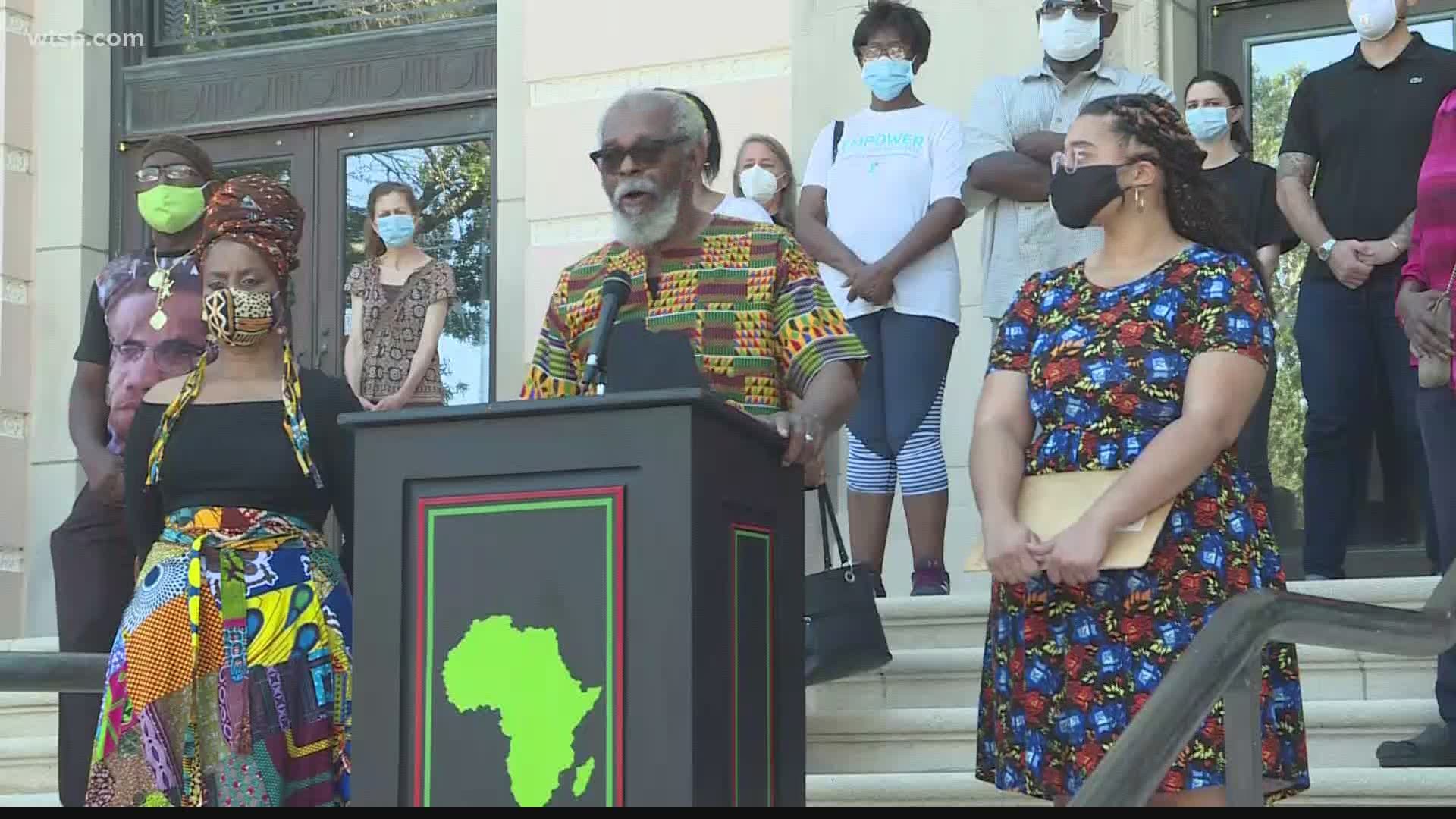 Omali Yeshitela spoke on the steps of City Hall on Monday, talking about his role in tearing down a racist mural in the 1960s.