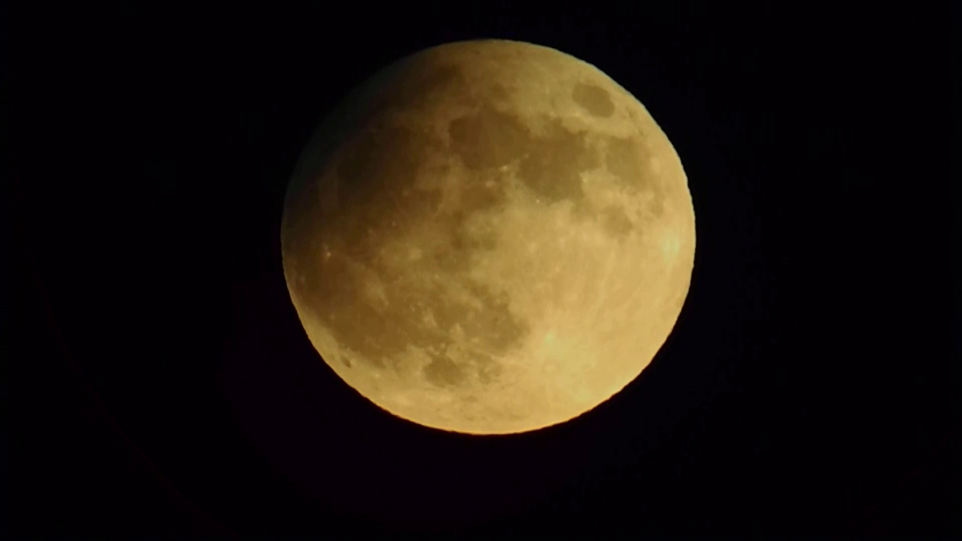 Timelapse of the partial lunar eclipse after the full supermoon rises on the edge of the Coachella Valley in California.