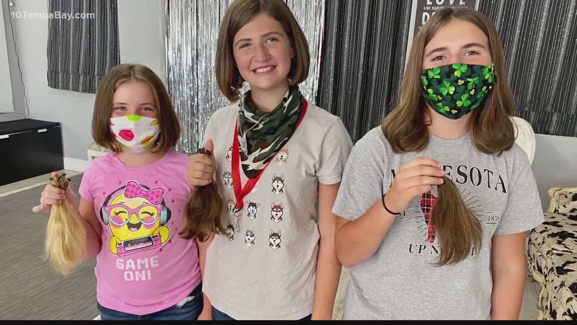 Lydia, Holly, and Etta each gave eight inches of hair at LaDee-Da Kids Spa last weekend. Their hair will go to a nonprofit making wigs for kids losing their hair