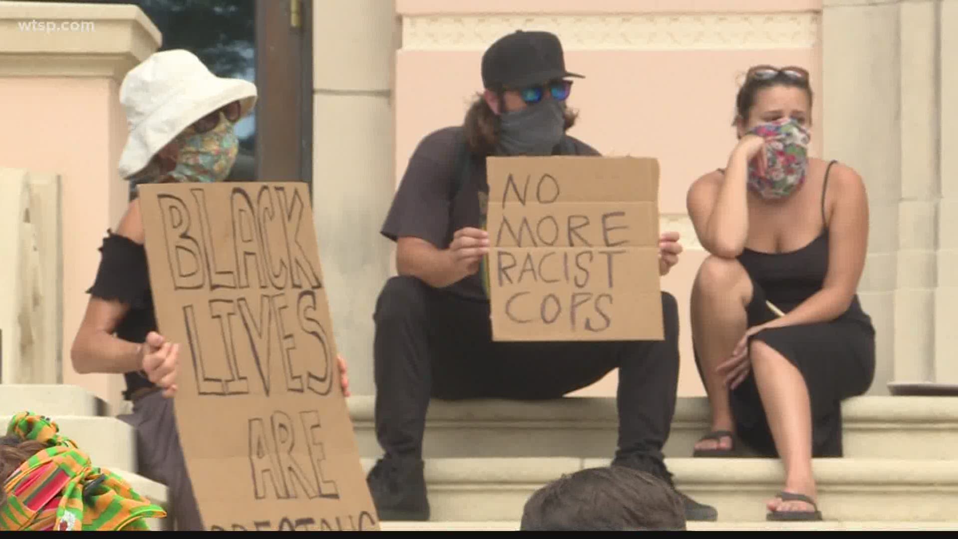 People gathered at City Hall to protest for systemic change.