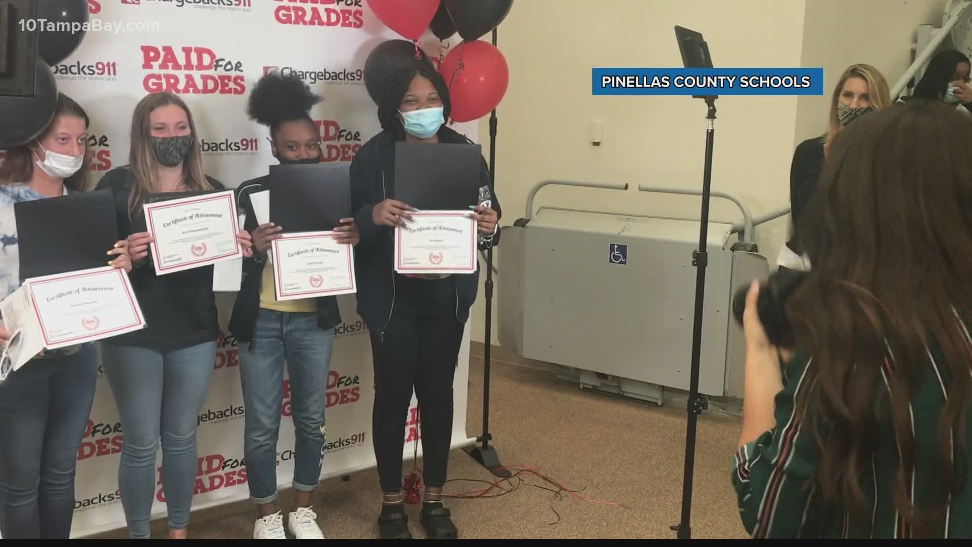 Nearly 100 Pinellas County students received $500 for good grades at graduation.