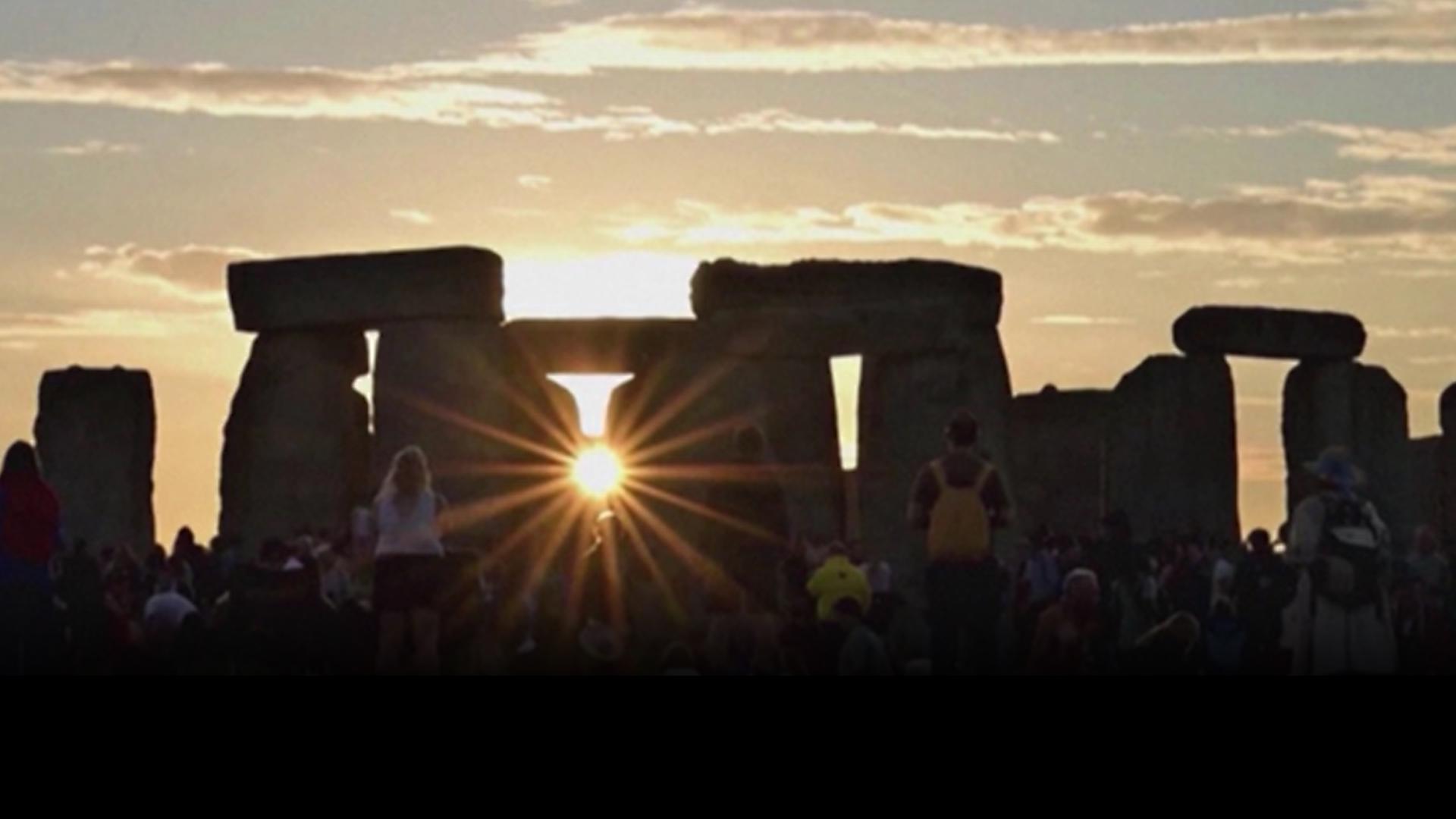 People gathered at Stonehenge in England to watch the sunset and celebrate the summer solstice on Thursday (6/20).