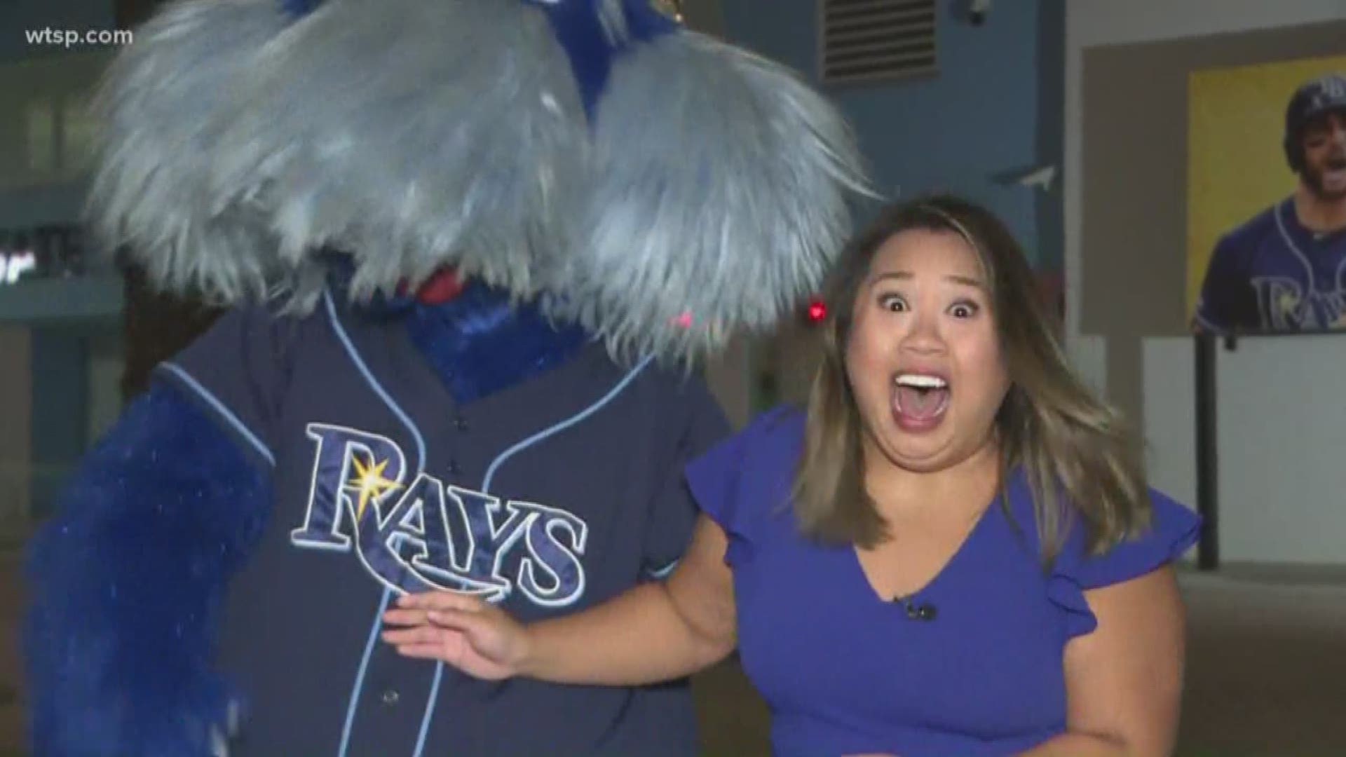 Raymond of the Rays welcomes 10News' Thuy Lan with a kiss
