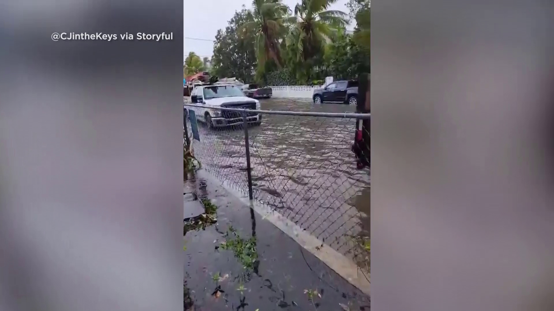 One video shows a flooded street and yard in Key West as heavy rain battered the region.