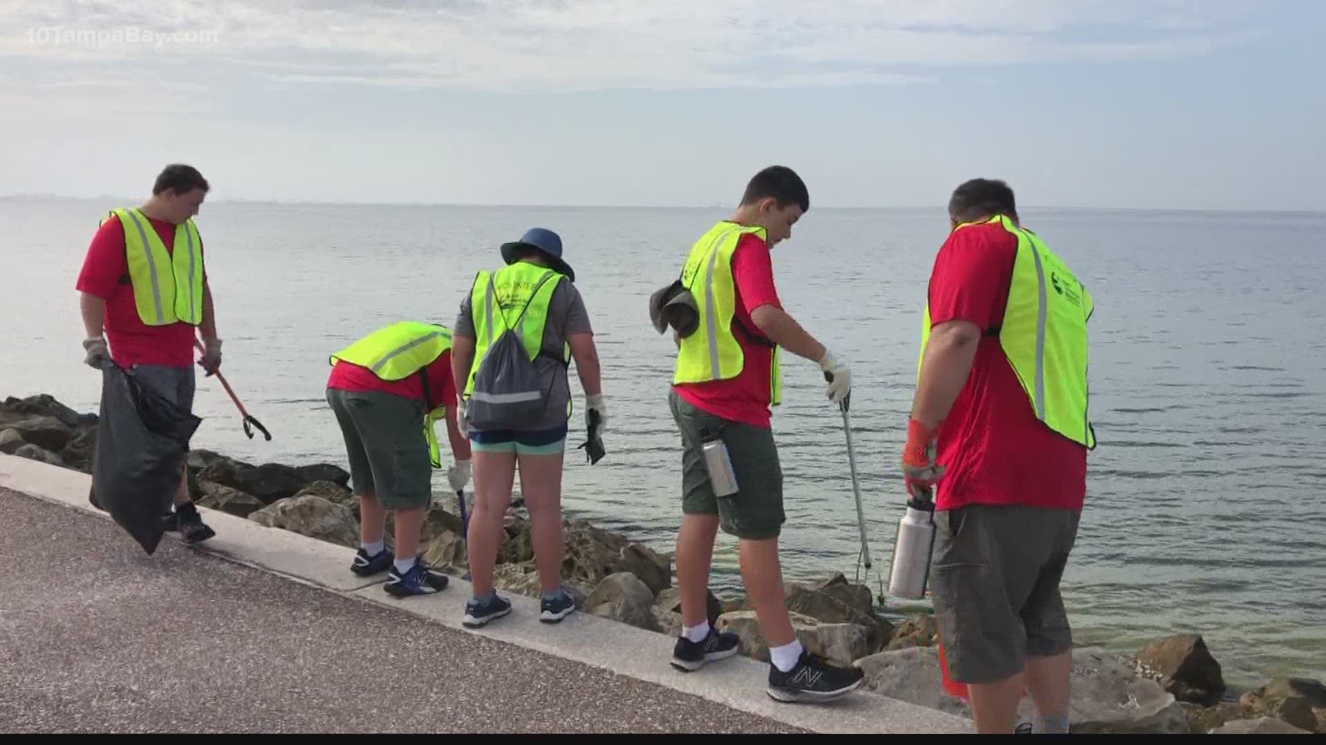 Volunteers combed beaches to collect trash after Boom on the Bay fireworks show.