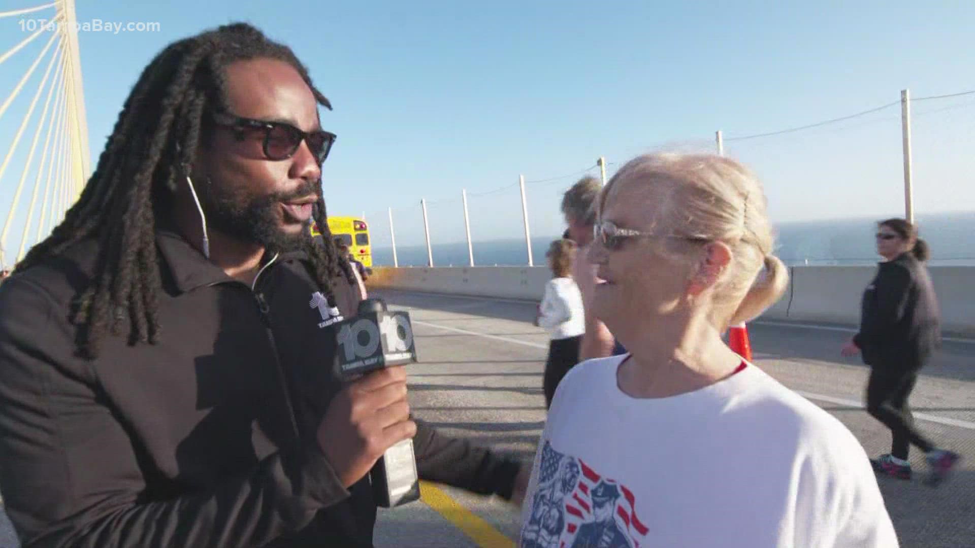 10 Tampa Bay's Jabari Thomas talks with one of the racers of the Skyway 10K.