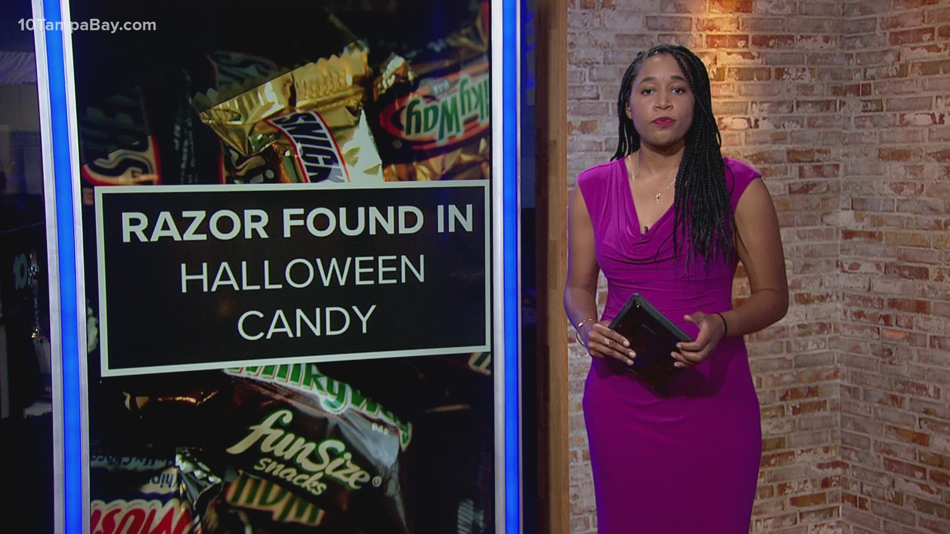 The little girl was eating a 100 Grand mini chocolate bar that she got trick-or-treating.