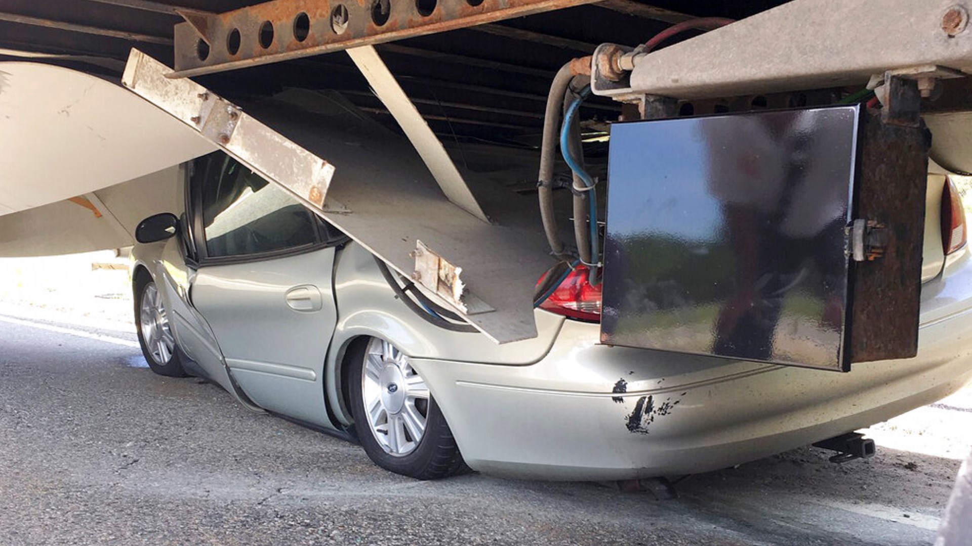 Driver Escapes Serious Injury After Car Slides Under Semi | Wtsp.com