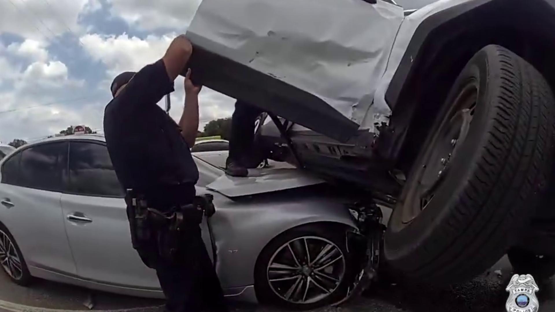 Officers were able to pull a driver and his 7-year-old son from a car after a crash on East Fowler Avenue.