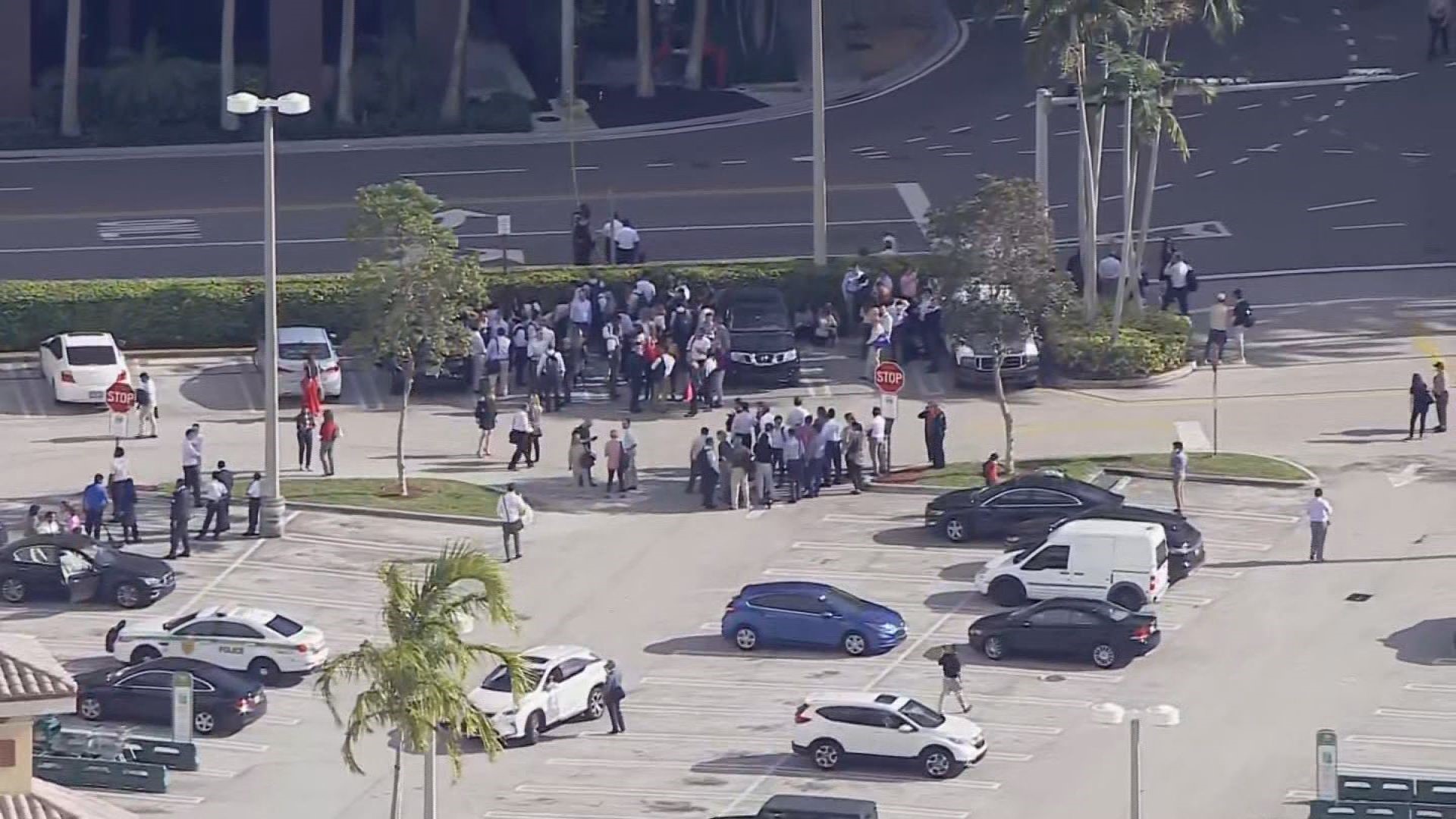 People in Miami gather outside after reports of buildings shaking following the 7.7 magnitude earthquake in the Caribbean Sea.