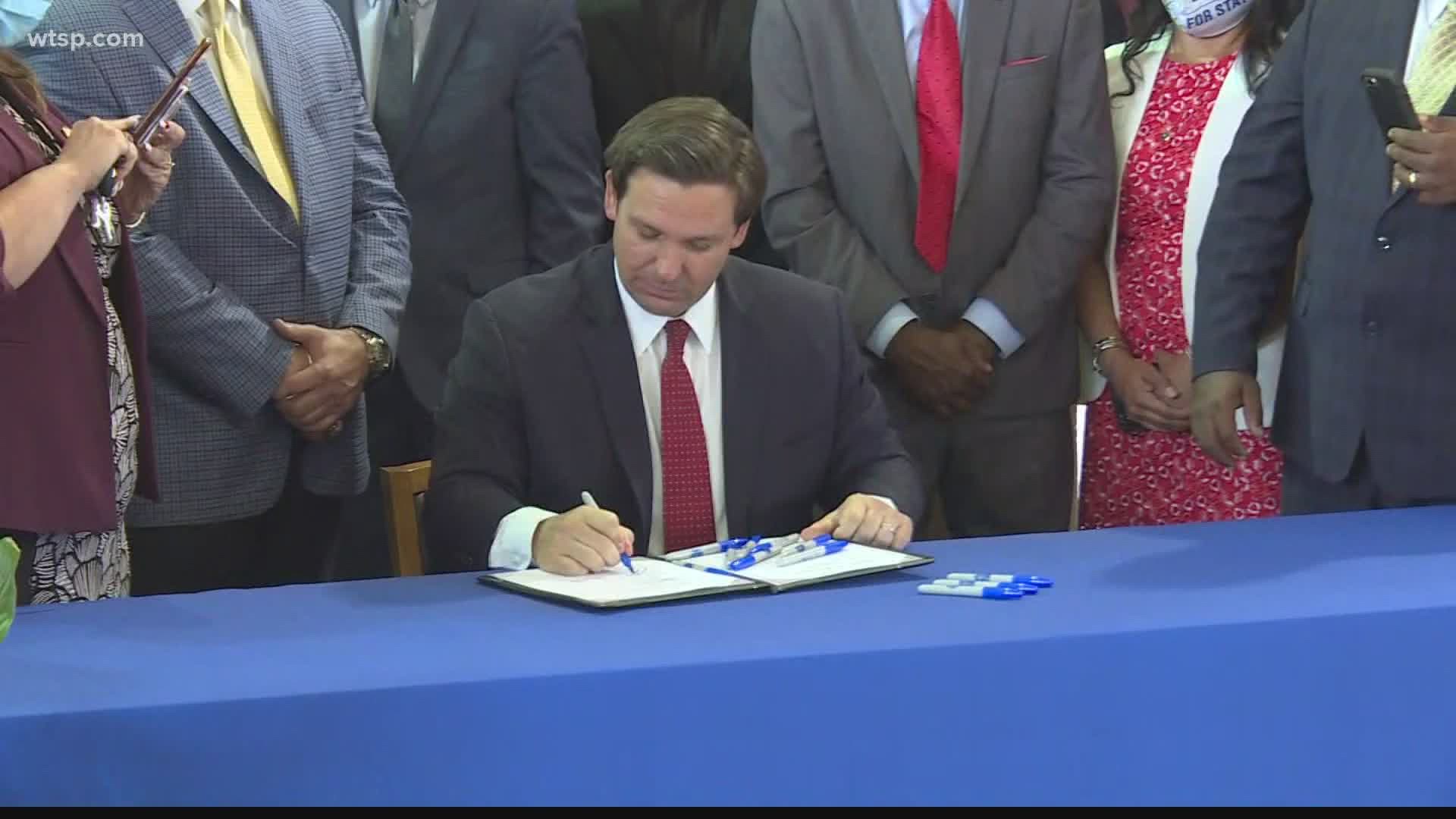 After signing a bill that expands a private school scholarship program, DeSantis took questions about the state's coronavirus response.