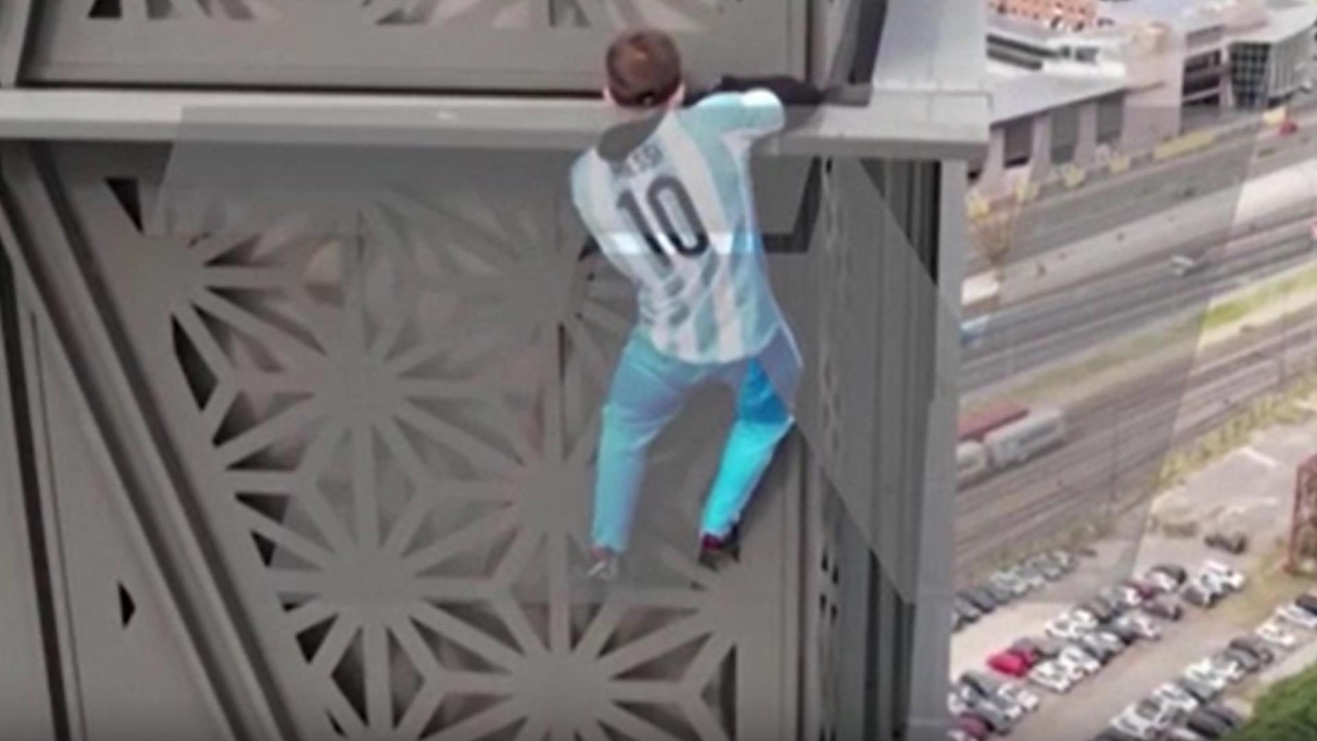 A man attempted to climb to the top of a 410-foot high 30-story building without safety equipment in Buenos, Argentina, on Tuesday (6/11).