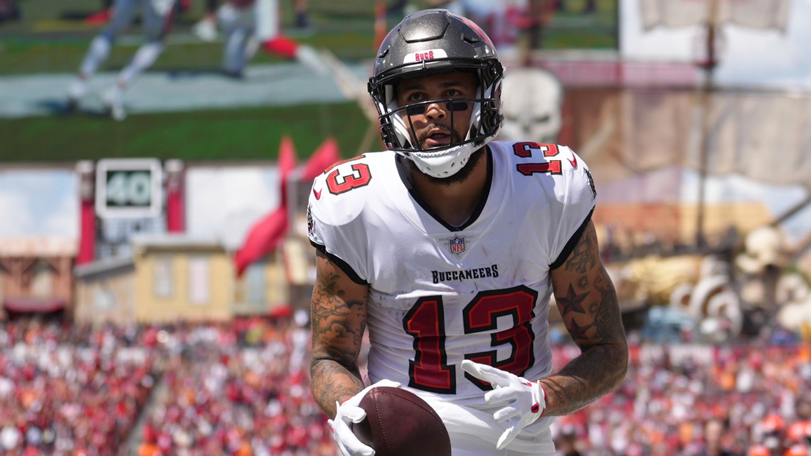 Tampa Bay Buccaneers wide receiver Mike Evans (13) points to a fan after  catching a touchdown pass during an NFL football game against the Chicago  Bears, Sunday, Sept. 17, 2023, in Tampa