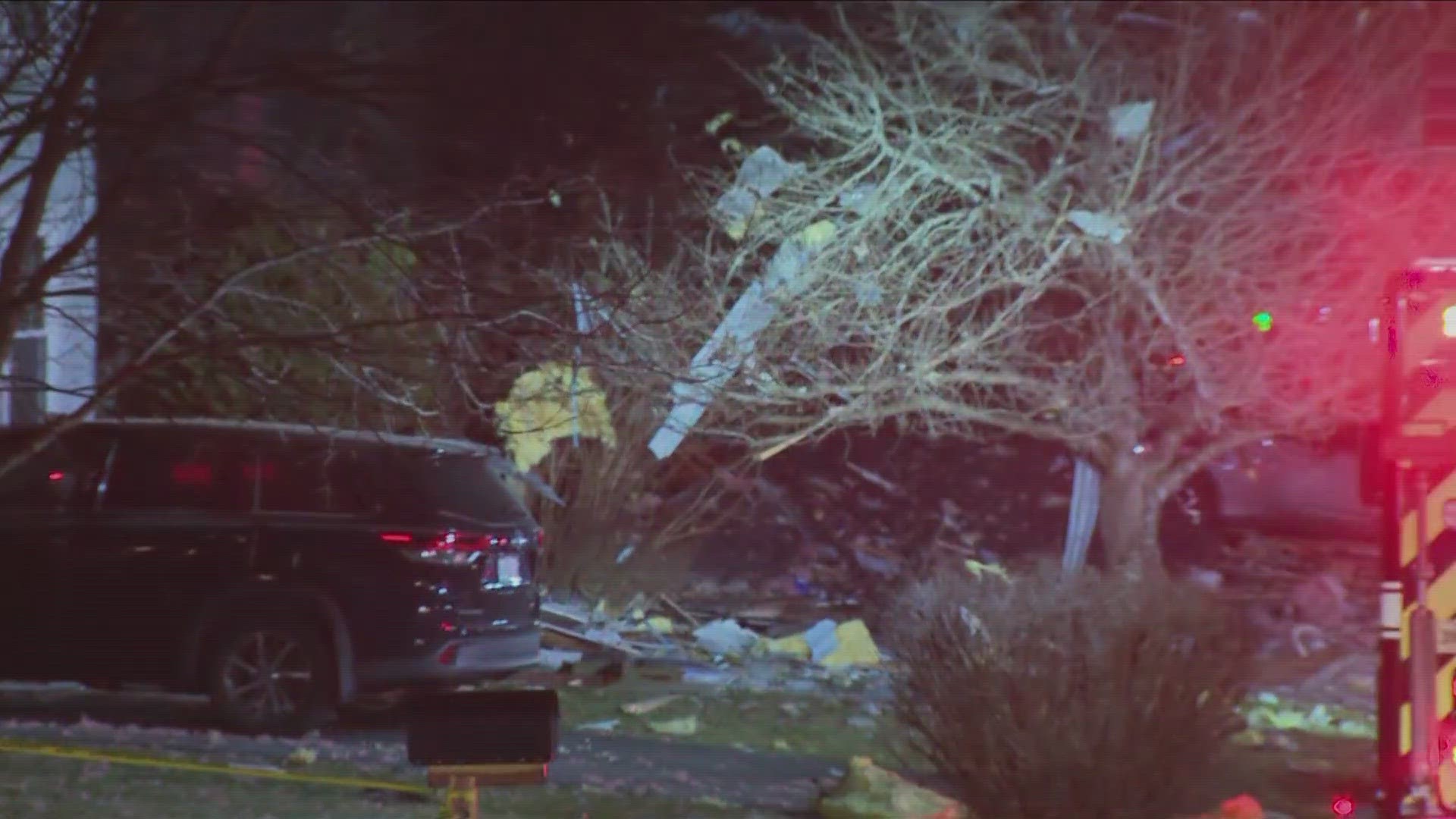 Virginia House Explosion Firefighters searching burning rubble